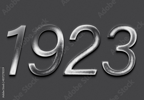 Chrome metal 3D number design of 1923 on grey background.