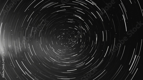 Star trail photograph  featuring concentric circles of starlight that radiate from a central point  indicative of the Earth s rotation around its axis
