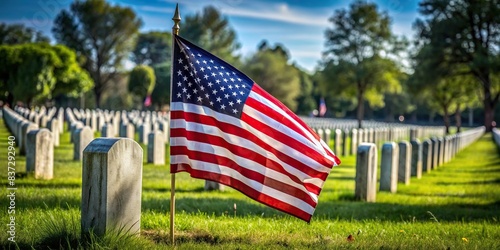 American flag waving in front of gravestones in a cemetery