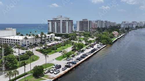 BOCA RATON, FLORIDA Aerial footage of the upscale coastal community in Boca Raton, Florida, highlighting luxurious waterfront homes, high-rise condominiums, and commercial buildings.