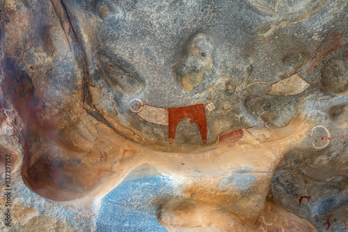 Ancient tribal rock artwork primitive carvings of cow figure, Laas Geel, Maroodi Jeex, Hargeisa, Somaliland photo