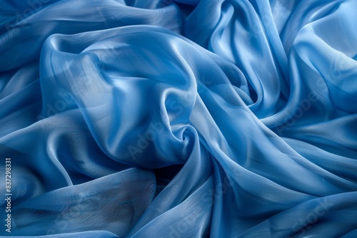 Close up of a blue fabric with a very large amount of folds