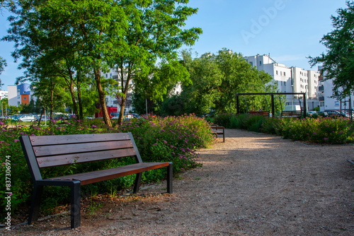A modern housing estate surrounded by greenery, near the park