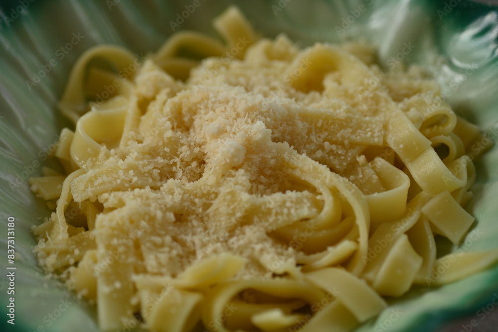 pasta sprinkled with parmesan cheese as a background pasta sprinkled with parmesan cheese as a background