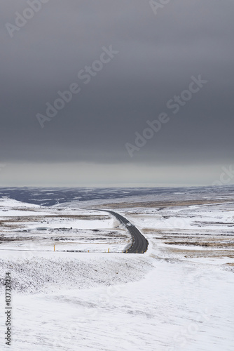 Road in the middle of the snow in Iceland photo