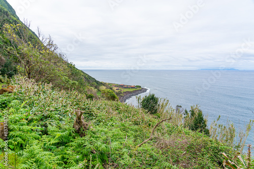 Surrounding landscape and pedestrian access via a dirt path towards Fajã de Santo Cristo and Fajã dos Cubres. São Jorge Island-Azores-Portugal.05-05-2024 photo