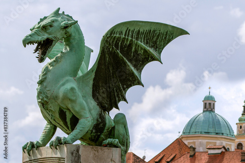 LJUBLJANA, SLOVENIA, May 07, 2023. The Dragon Bridge is one of the most recognizable and iconic landmarks of Ljubljana, the capital of Slovenia. A detail of the bridge are bronze statues of dragons. 