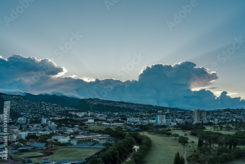 Ala Wai Golf Course / Kaimuki / Kapahulu, Sunlight shining through clouds, giving rise to crepuscular rays，Honolulu Oahu Hawaii. photo