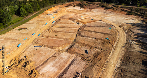 Graded dirt lots ready for new house and neighborhood construction