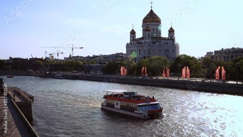 Cathedral View with Ships Sail Along the Moscow River in Summer