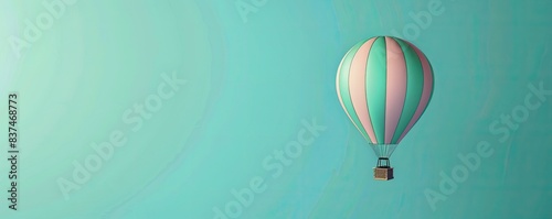 Hot air balloon with pink and green stripes floating in a clear blue sky, capturing a serene and tranquil atmosphere. photo