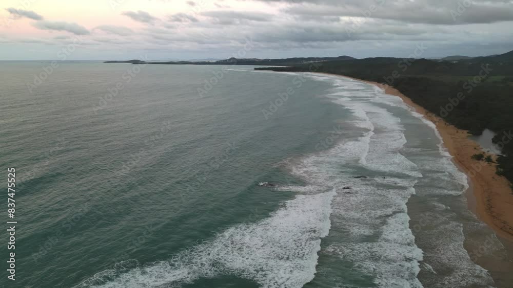 waves crashing on the shoreline of tropical island paradise vacation travel tourism destination (luquillo, puerto rico) sand wave beach shore (sunset, dusk, night time, getaway) aerial drone footage waves crashing on the shoreline of tropical island paradise vacation travel tourism destination (luquillo, puerto rico) sand wave beach shore (sunset, dusk, night time, getaway) aerial drone footage