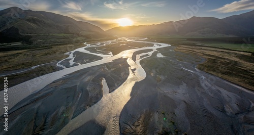 The Waiau Uwha river and mountain range at sunset. Hanmer Springs, Culverden, Canterbury, New Zealand. photo