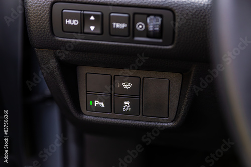 close-up of off road, parking brake, auto hold buttons. modern car interior © Виталий Сова