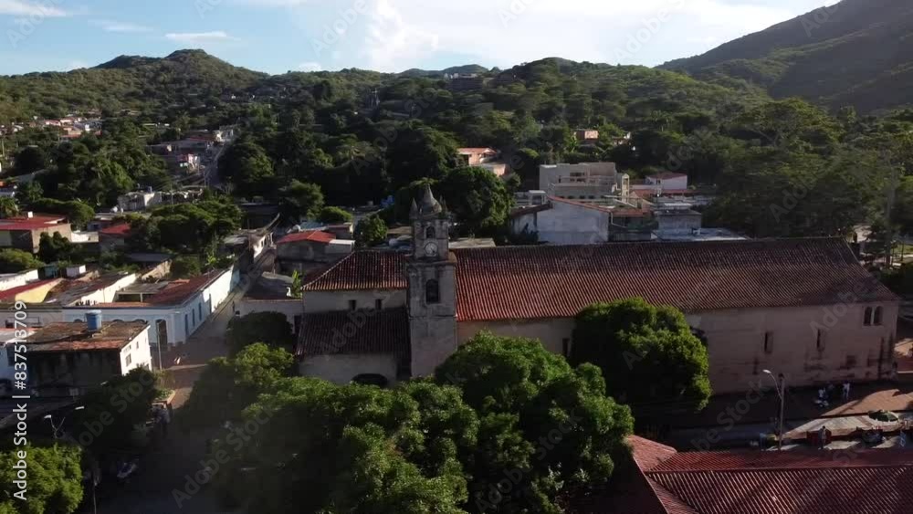 Aerial orbiting shot of nuestra senora de la Asunción church in small city of Venezuela. Oldest church in Venezuela. Aerial orbiting shot of nuestra senora de la Asunción church in small city of Venezuela. Oldest church in Venezuela.