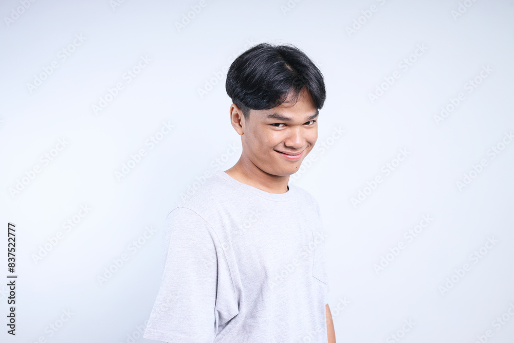 Portrait Of Funny Young Asian Man Joking Isolated On White Background. Funny Man Flirting. Portrait Of Funny Young Asian Man Joking Isolated On White Background. Funny Man Flirting.