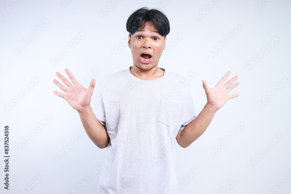 Potrait Of Funny Young Asian Man Showing Suprised Gesture Isolated On White Background Potrait Of Funny Young Asian Man Showing Suprised Gesture Isolated On White Background