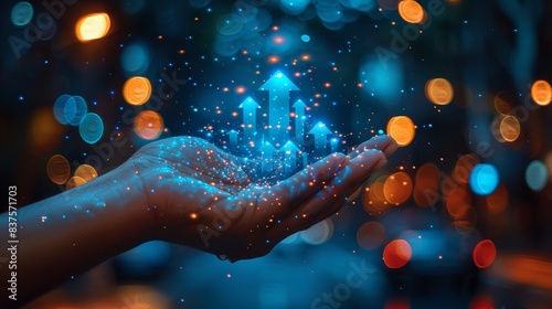 Hand holding sparkling digital arrows with blurred lights in the background, symbolizing growth and technology advancement.