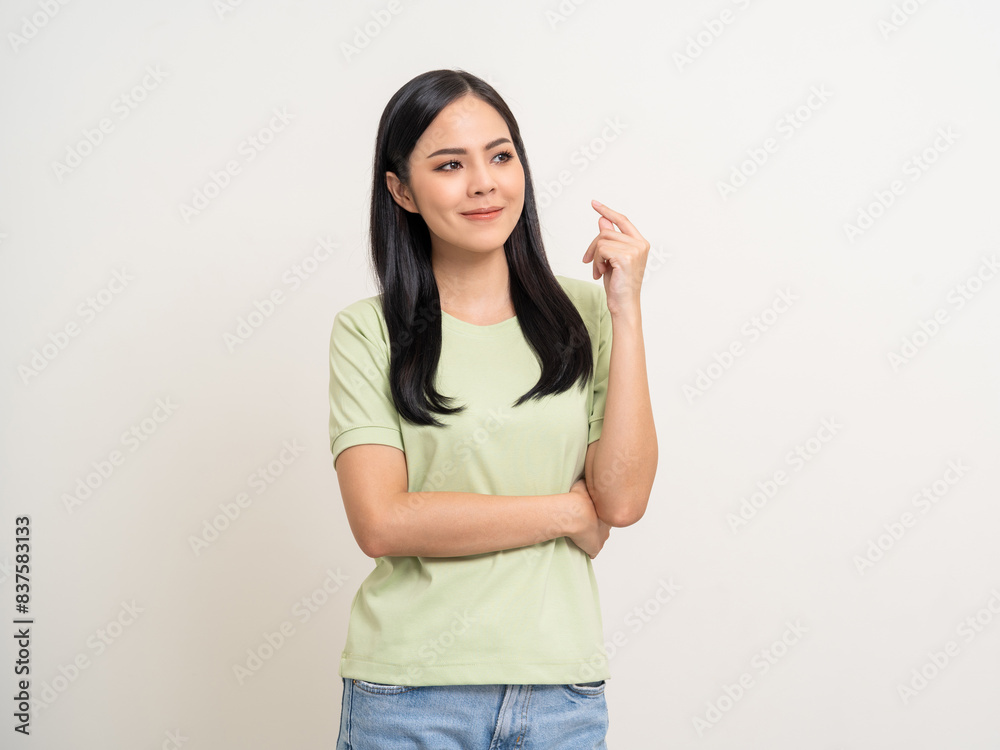 Beautiful young asian woman in green shirt. Charming female lady standing pose thinking on isolated white blank background. Asian woman cute people have idea looking copy space for text advertise Beautiful young asian woman in green shirt. Charming female lady standing pose thinking on isolated white blank background. Asian woman cute people have idea looking copy space for text advertise