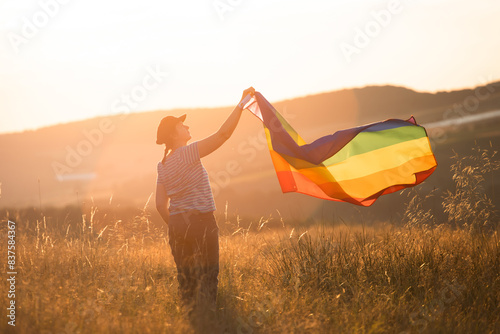 Young woman with LGBT flag.