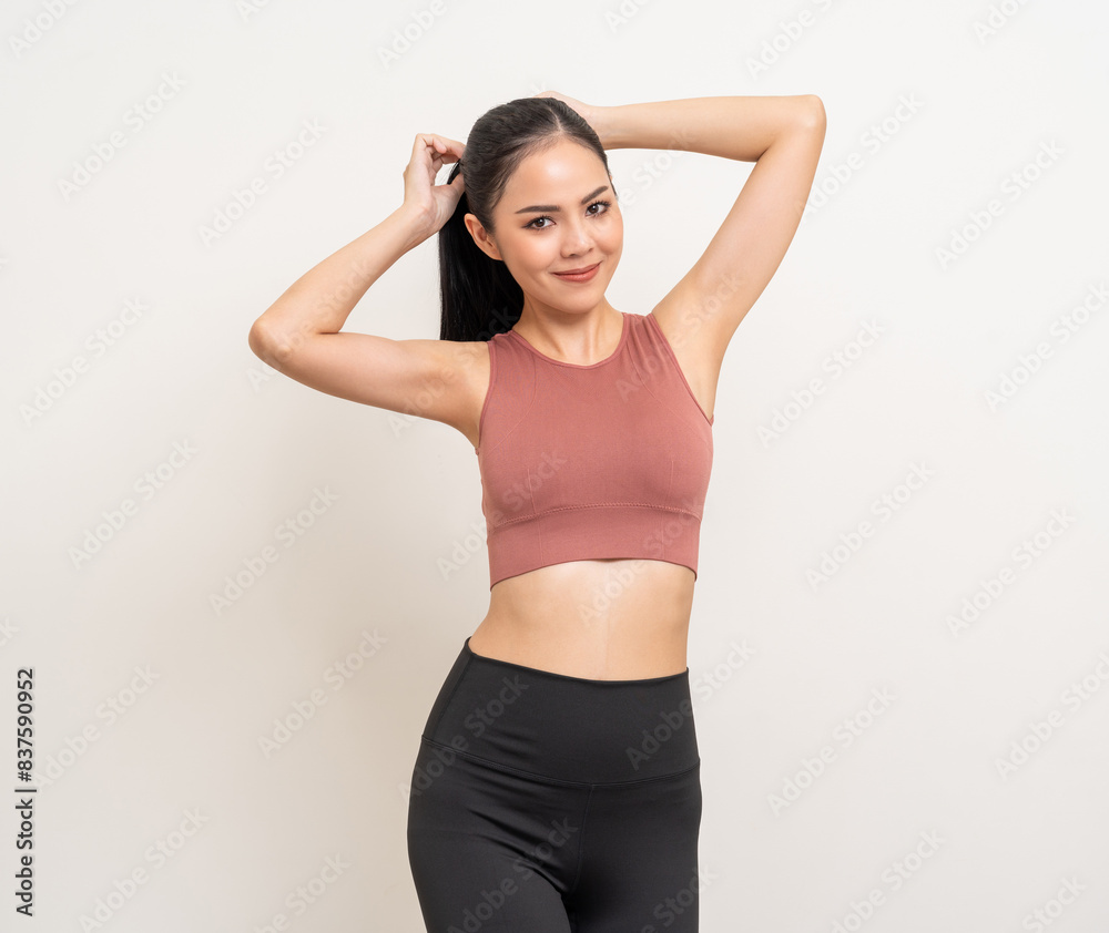 Young beautiful smiling asian woman with sportswear on isolated white background. Portrait happy healthy slim fit and firm latin attractive sporty woman standing pose exercise workout in studio. Young beautiful smiling asian woman with sportswear on isolated white background. Portrait happy healthy slim fit and firm latin attractive sporty woman standing pose exercise workout in studio.
