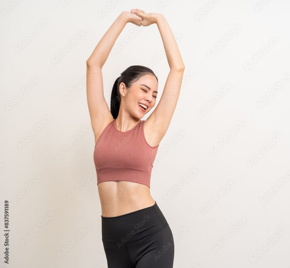 Young beautiful smiling asian woman with sportswear on isolated white background. Portrait happy healthy slim fit and firm latin attractive sporty woman standing pose exercise workout in studio. Young beautiful smiling asian woman with sportswear on isolated white background. Portrait happy healthy slim fit and firm latin attractive sporty woman standing pose exercise workout in studio.