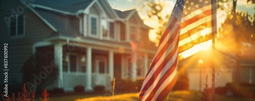 The image shows a beautiful house with an American flag waving in the front yard
