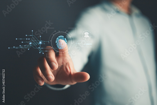 Businessman protecting personal data on finger print with virtual screen interfaces. Cyber security and privacy concepts to protect data. Lock icon and internet network security technology.