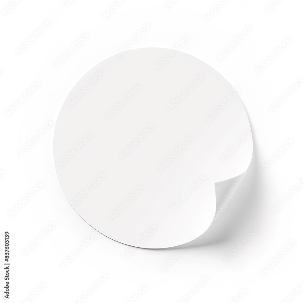 Curled white circular sticker with shadow on plain background Curled white circular sticker with shadow on plain background
