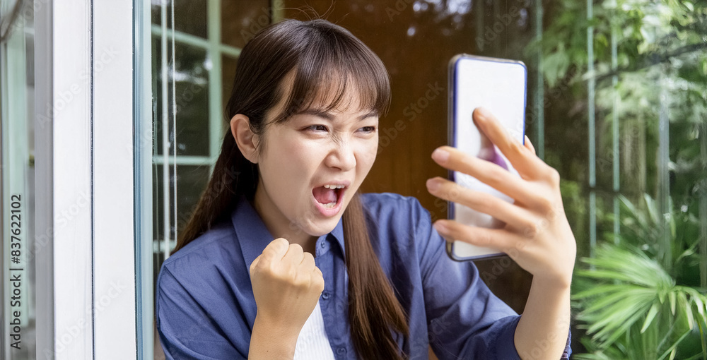 Young oriental woman complaining over the phone. Young oriental woman complaining over the phone.