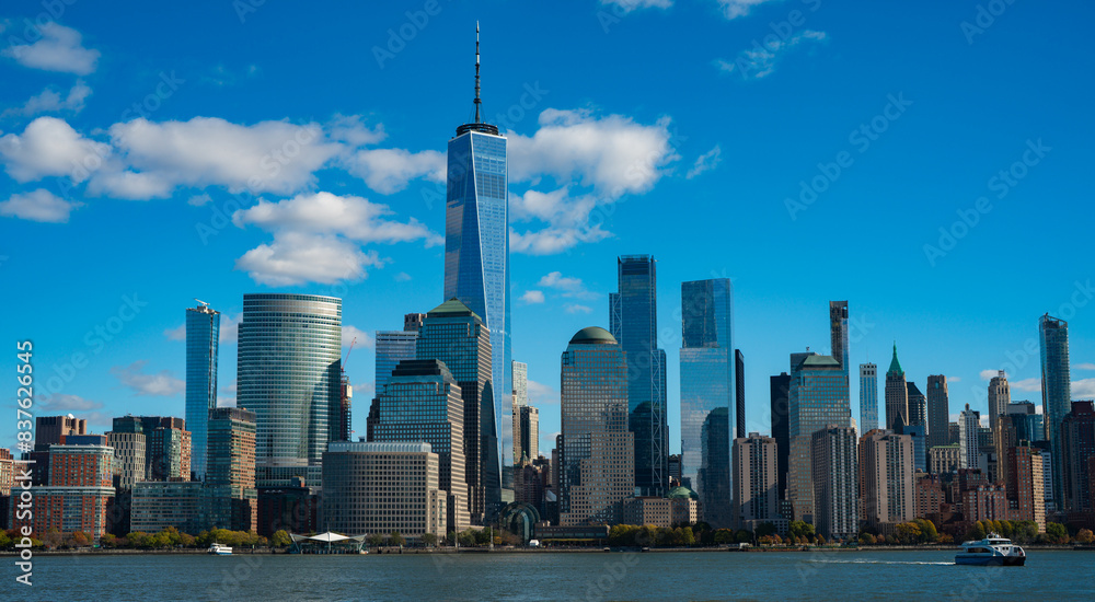 New York, United States. New York city skyline in Midtown Manhattan. USA, NYC, NY, Manhattan. American big city. Lower Manhattan skyline. New York from New Jersey. Downtown Manhattan with blue sky.