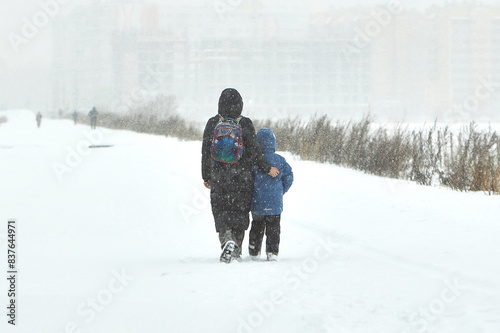 Wallpaper Mural Couple Walking Across Snow Covered Field During Winter Snowstorm Torontodigital.ca