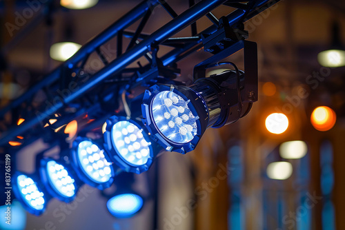 Lighting truss system with spotlights in an indoor theater or conference hall, closeup view. ,photo in the style of canon
