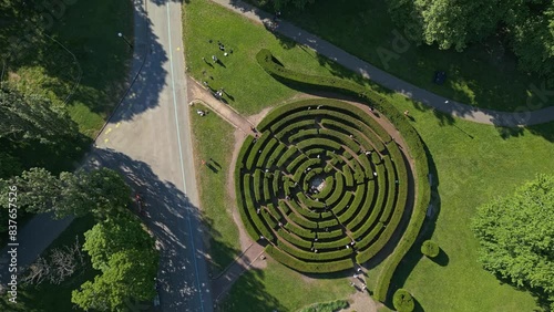 Tourists wander through the maze at Slottsskogen Labyrinth in the center of Gothenburg, Sweden photo