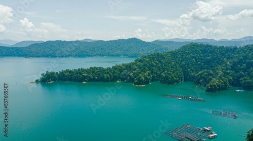 Aerial drone view of Kenyir Lake or Tasik Kenyir which is located at Kuala Berang in Hulu Terengganu, Terengganu, Malaysia photo