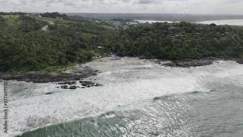 Drone orbits to the right from sea facing Tiririca Beach photo