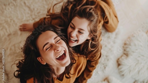 Laughing duo on a comfy background