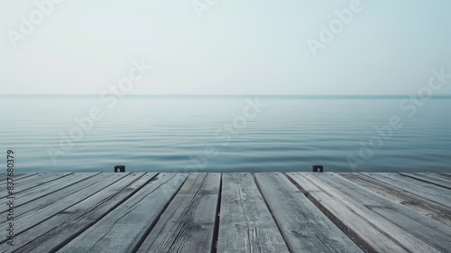 An old weathered dock over a peaceful ocean  evoking a sense of quiet and stillness