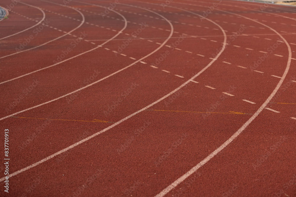 Fototapeta premium A track with white lines and red background