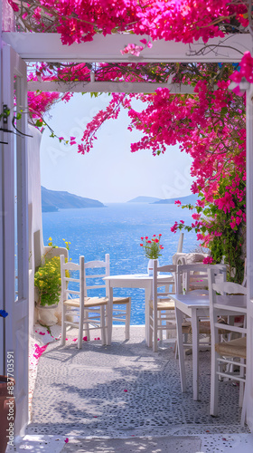 Fototapeta Naklejka Na Ścianę i Meble -  Greek resort, view from a cafe covered with bougainvillea to the sea