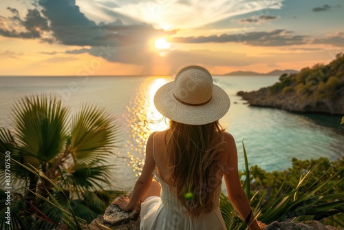 Woman enjoying a tropical seaside sunset