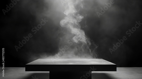 A sleek, square podium with smoke rising from the bottom against a dark background.