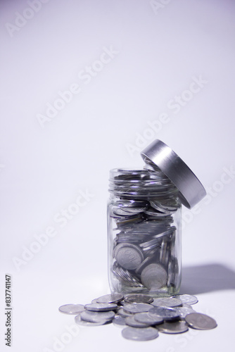 Bandung, Indonesia 3 June 2024. Metal rupiah money in a jar, rupiah is Indonesia's currency.