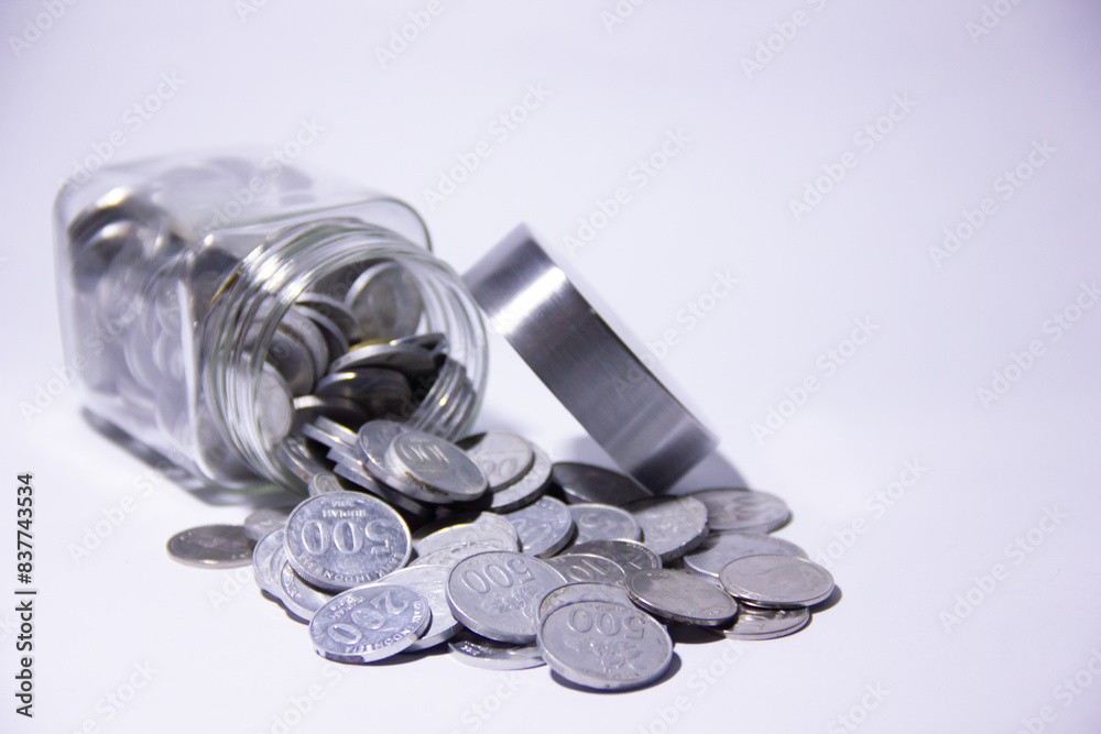 Bandung, Indonesia 3 June 2024.
Metal rupiah money spills out of the jar, rupiah is Indonesia's currency. Bandung, Indonesia 3 June 2024.
Metal rupiah money spills out of the jar, rupiah is Indonesia's currency.