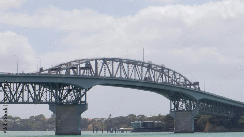 Aerial Shot of Auckland Harbour Bridge with traffic on it, vehicles are moving, New Zealand, Cloudy weather, Aerial Shot of Auckland Harbour Bridge with traffic on it, vehicles are moving, New Zealand, Cloudy weather,