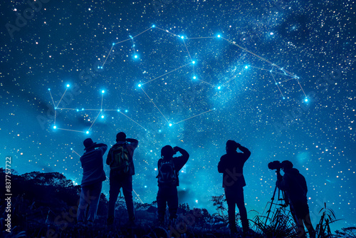 Group of people stargazing and observing the night sky filled with stars.