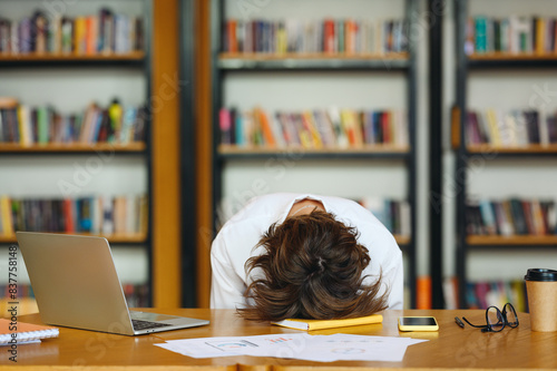 Obraz na plátne Young sad tired frustrated exhausted sleepy weary sad employee business woman wear white shirt casual clothes put head down on table sit work at office desk with pc laptop