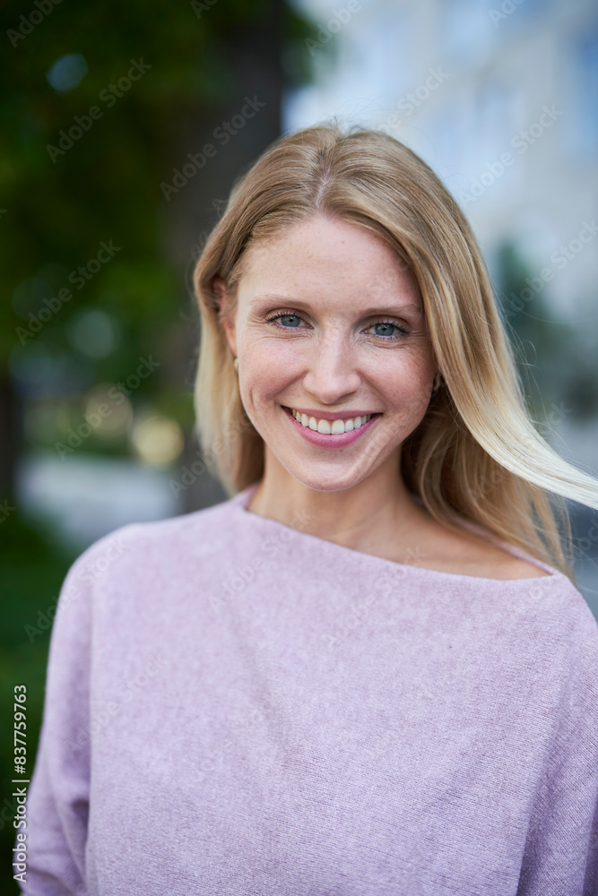 Happy woman wearing purple sweater Happy woman wearing purple sweater