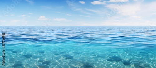A solitary sailboat near a stunning reef in crystal-clear waters with a vast expanse of unoccupied space for text or design, known as copy space image.