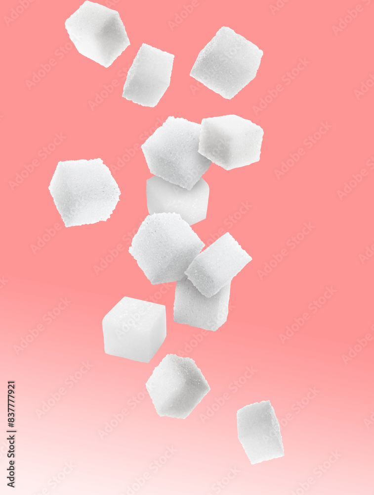 Refined sugar cubes in air on color gradient background Refined sugar cubes in air on color gradient background